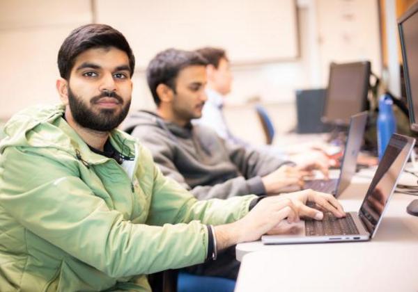 Male students working in a computer lab