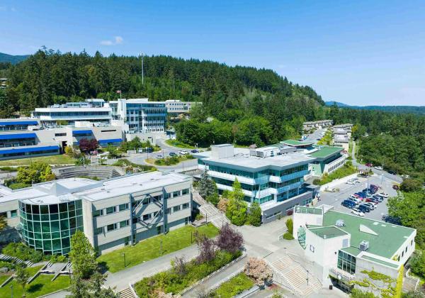 Buildings on a mountainside under a blue sky