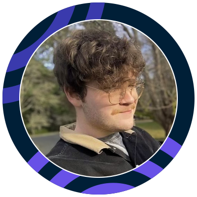 Young man with curly brain hair wearing a mustache and glasses