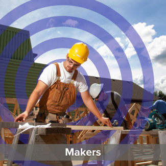 Young man in a hard hat working at an outdoor construction site